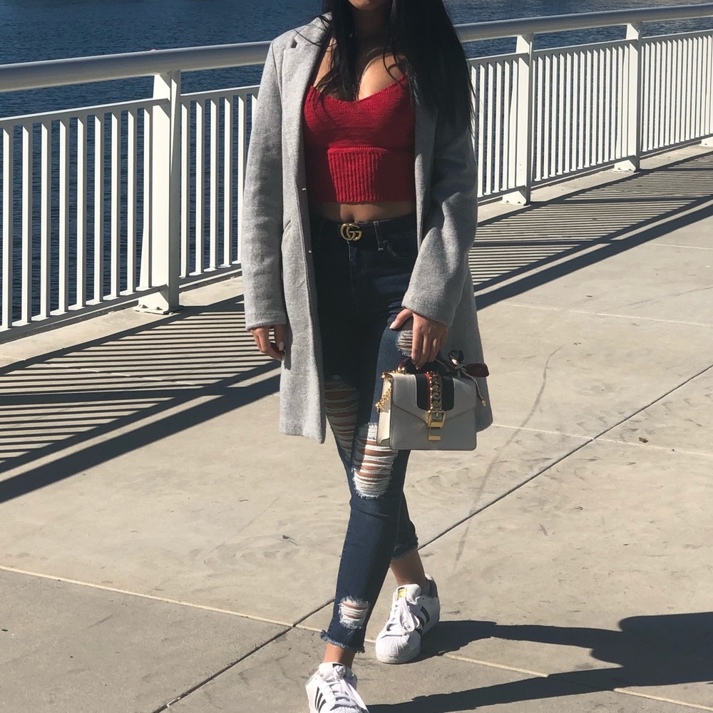 Gray jecket and blue jeans
